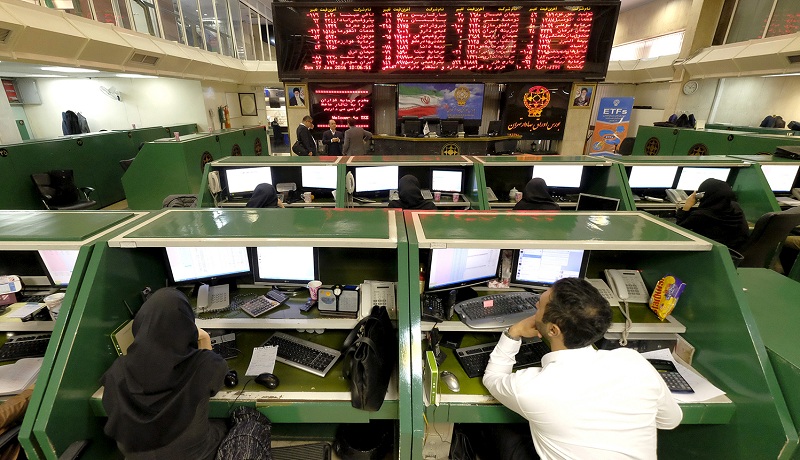 Stock market employees work at Tehran's Stock Exchange